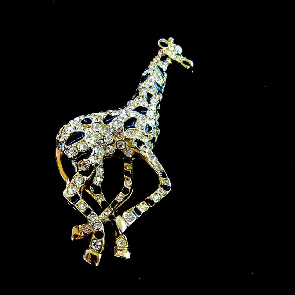 Vintage clear rhinestone & black enamel giraffe brooch - gold tone setting